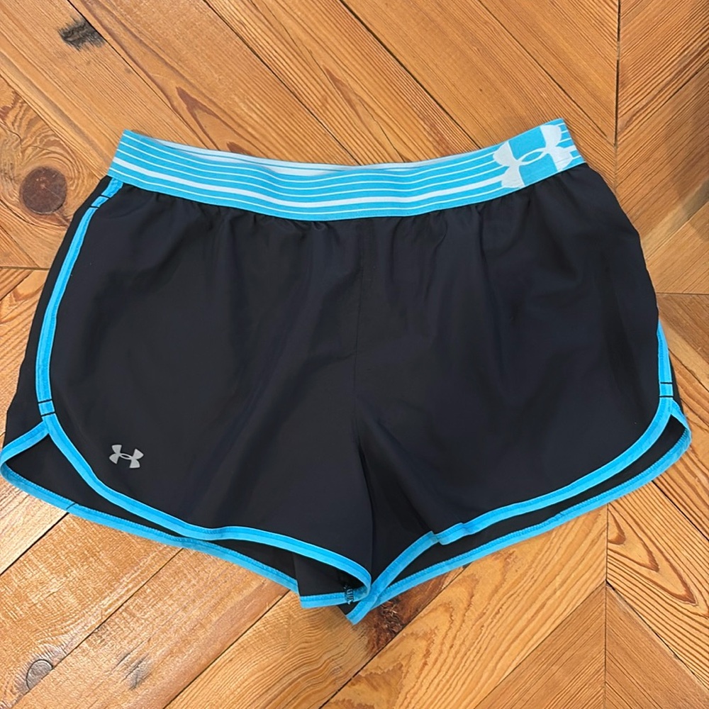 Women’s Under Armour heat gear shorts in medium.